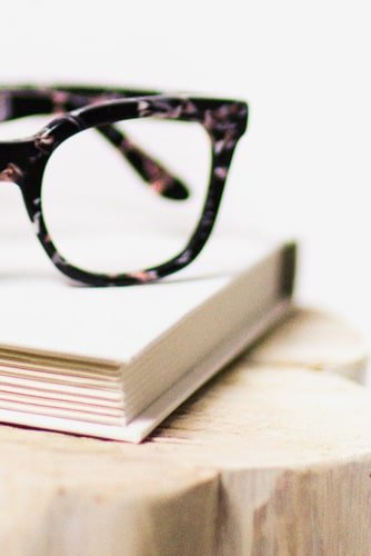 A showcase of the Best Smart Glasses Collection of 2026, featuring multiple frames in transparent, black, and tortoiseshell patterns arranged professionally alongside lifestyle product photography.